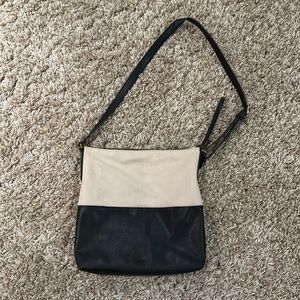Black leather bottom with ivory cotton top crossbody purse.